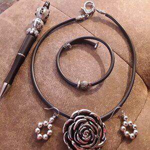 Silver plated set and fancy pen, this unique pen will  collect many compliments.